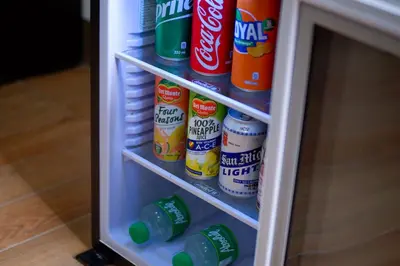 a refrigerator filled with lots of food and drinks at Achievers Airport Hotel in Manila