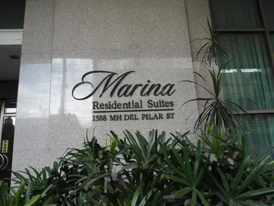 a sign for the marina residential suites at Suites de Marina Manila with Netflix in Manila
