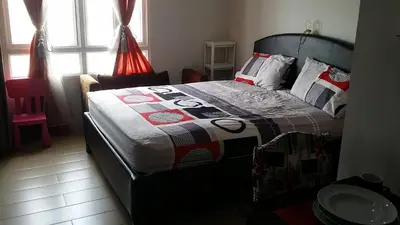a bedroom with a bed with a quilt on it at 150 Newport City Condo - near NAIA T3 AIRPORT MANILA in Manila