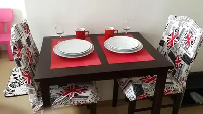 a table with two plates and glasses on it at 150 Newport City Condo - near NAIA T3 AIRPORT MANILA in Manila
