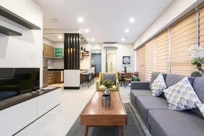 a living room with a couch and a table at Artemis Place Makati Hotel in Manila