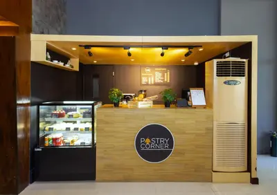 a food counter in a restaurant with a food at The B Hotel Alabang in Manila