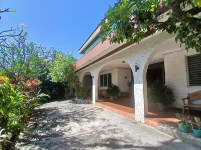an outside view of a house with a patio at Casa Joaquin BnB in Manila