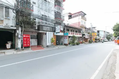 an empty street in a city with buildings at RedDoorz at DBuilders Rooms Ph1 Taguig in Manila