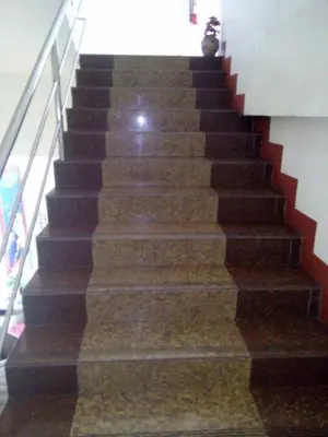 a staircase in a building with a stair case at Asia Novo Boutique Hotel - Rosario in Rosario