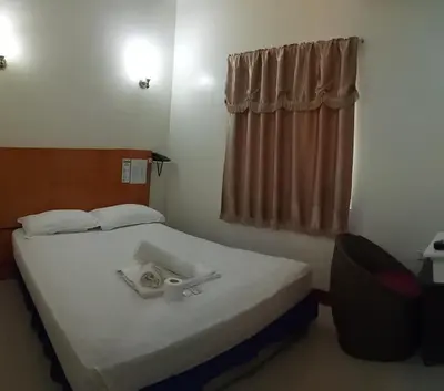 a hotel room with a bed and a window at Asia Novo Boutique Hotel - Rosario in Rosario