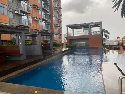 a swimming pool in the middle of a building at Penthouse suite at Porto Vita Towers in Cubao Quezon City in Manila