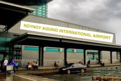 a car parked in a parking lot in front of an airport at Azure C7 Balcony, Wifi, Near Mall Airport in Manila