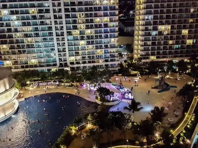 a view of a city at night with buildings at Azure C7 Balcony, Wifi, Near Mall Airport in Manila