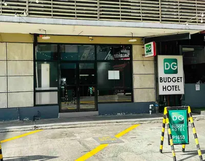 a building with a burger hut sign in front of it at DG Budget Hotel Salem in Manila