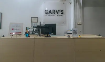 a desk with a computer on top of it at RedDoorz Plus at Boni Avenue Mandaluyong in Manila