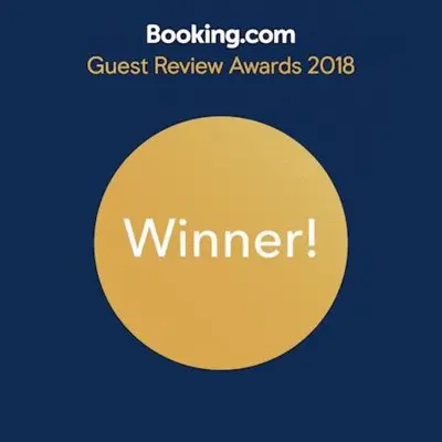 a yellow circle with the words guest review awards at Travellers 101 Condo near Manila Airport in Manila
