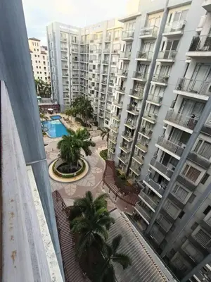 an overhead view of a courtyard with palm trees and buildings at Palm Tree Villas 1 in Manila
