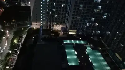 an overhead view of a building at night at Jazz Residences Condo in Manila