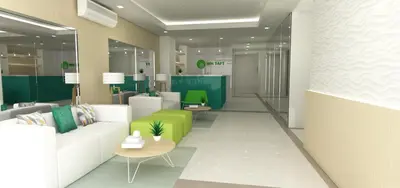 an office lobby with a white couch and green chairs at Titan 22P Condo at WH Taft Residences Manila in Manila