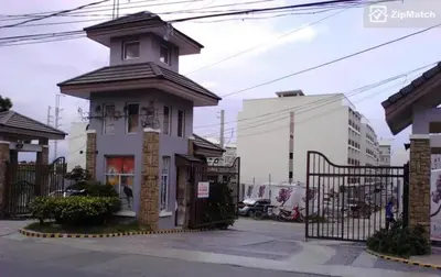 a small house with a tower on top of it at Jen's Paranaque City Apartment in Manila
