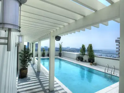 a swimming pool on the roof of a building at Armada Hotel Manila in Manila
