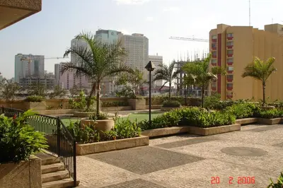 a garden with trees and plants in a city at 67 sqm. Condo Unit in Robinson Place Residences in Manila