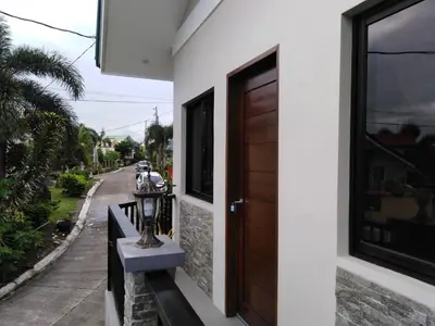 a door to a house with a street at Diaz Residence in Silang