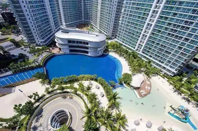 an aerial view of a resort with a swimming pool at Azure Urban Resort Maui Unit in Manila