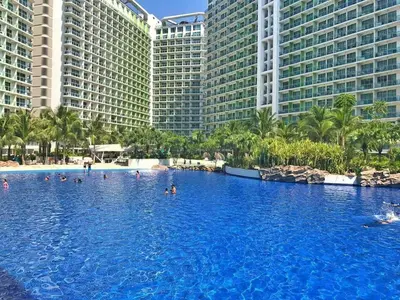a swimming pool in front of some tall buildings at Azure Urban Resort Maui Unit in Manila