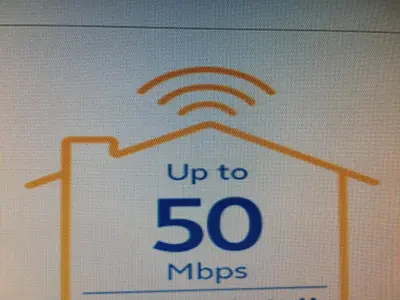 a sign that says up to mbps at 2BR avida tower near NAIA airport in Manila