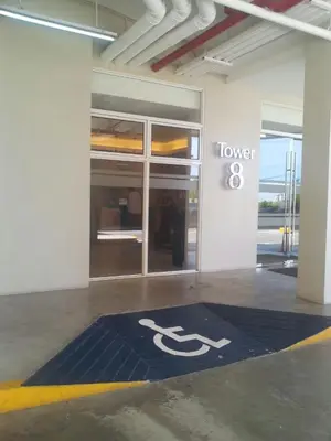 a building with a toilet sign on a blue rug at 2BR avida tower near NAIA airport in Manila