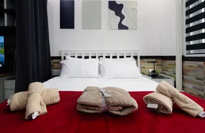 a bedroom with a bed with towels on it at Lotus Residence, Manila in Manila