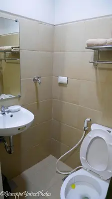 a bathroom with a toilet and a sink at Genesis unit SMDC Fields in Manila