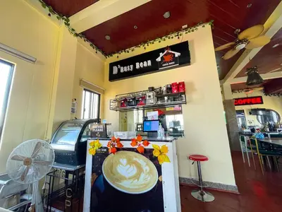 a coffee shop with a counter with a cup of coffee at Chanel Paris Hotel powered by Cocotel in Manila