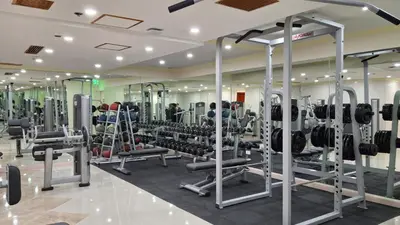 a gym with lots of treadmills and weights at Manila Prince Hotel in Manila
