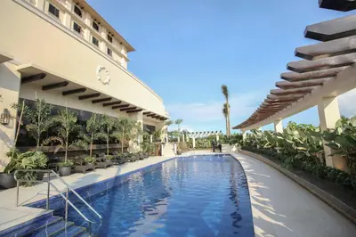 a swimming pool in the middle of a building at Mella Hotel Manila near NAIA Airport in Manila
