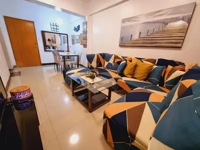 a living room with a couch and a table at Legarse Staycation at Montecito Residential Resort in Manila