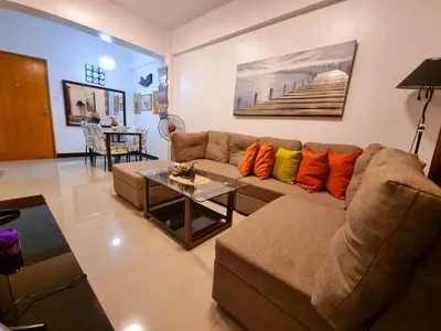 a living room with a couch and a table at Legarse Staycation at Montecito Residential Resort in Manila