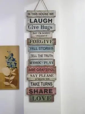 a stack of books hanging on a wall at Legarse Staycation at Montecito Residential Resort in Manila