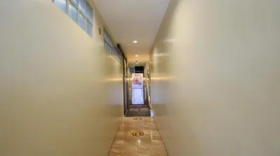 a hallway of a building with a long corridor at RedDoorz at Hotel Rosemarie in Manila