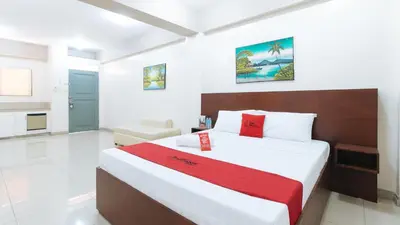 a bedroom with a large bed in a room at RedDoorz near Pasay Taft in Manila