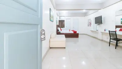 a room with a living room and a bedroom at RedDoorz near Pasay Taft in Manila
