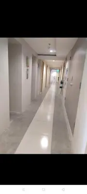 an empty hallway of an office building with a long corridor at Urban Deca Tower @ Graceysplace Unit 4 Mandaluyong in Manila