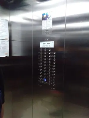 a glass elevator with a button on the side at Urban Deca Tower @ Graceysplace Unit 4 Mandaluyong in Manila