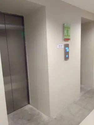 a elevator door in a building with a sign on the wall at Urban Deca Tower Graceysplace Unit unit 3113 Mandaluyong in Manila