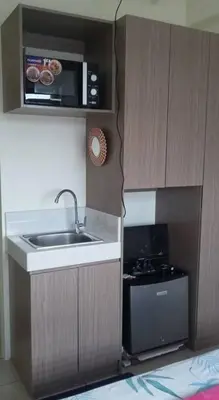 a small kitchen with a sink and a microwave at Urban Deca Tower Graceysplace Unit unit 3113 Mandaluyong in Manila