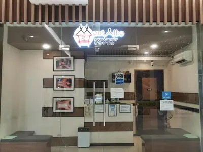 a store front with a sign on the wall at Liam's Pad at grace residences in Manila