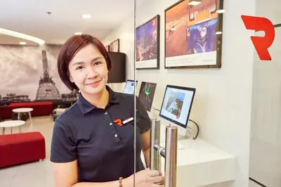 a woman standing in a store holding a pole at Red Planet Manila Malate Mabini in Manila