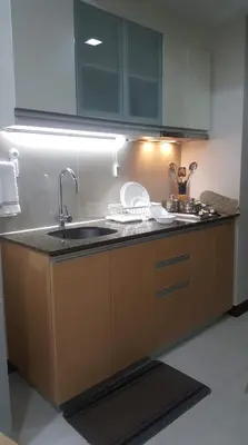 a kitchen with a sink and a counter top at 101 Newport Boulevard C3 in Manila