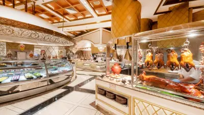 a buffet line with food in a restaurant at Okada Manila in Manila