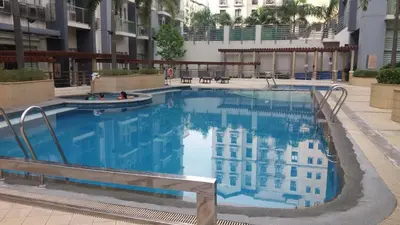 a large swimming pool in the middle of a building at One Palm Tree Villas close to Manila Airport - Terminal 3 in Manila