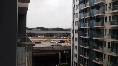 a view of a parking lot from a building at One Palm Tree Villas close to Manila Airport - Terminal 3 in Manila