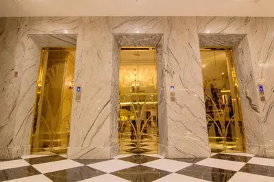 a lobby with a marble pillar in a building at 1898 Hotel Colonia En Las Filipinas in Manila