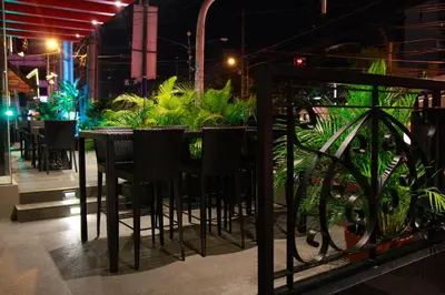 a bar with chairs and plants in a restaurant at 1898 Hotel Colonia En Las Filipinas in Manila